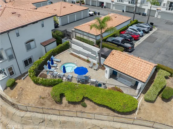 an aerial view of residential houses with yard