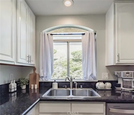 a kitchen that has a sink and a window