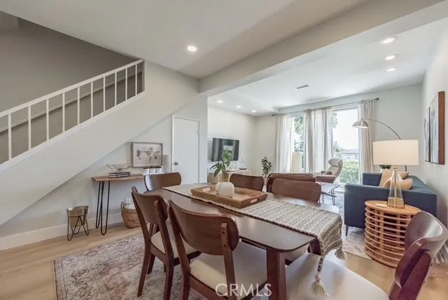 a view of a dining room with furniture window and wooden floor