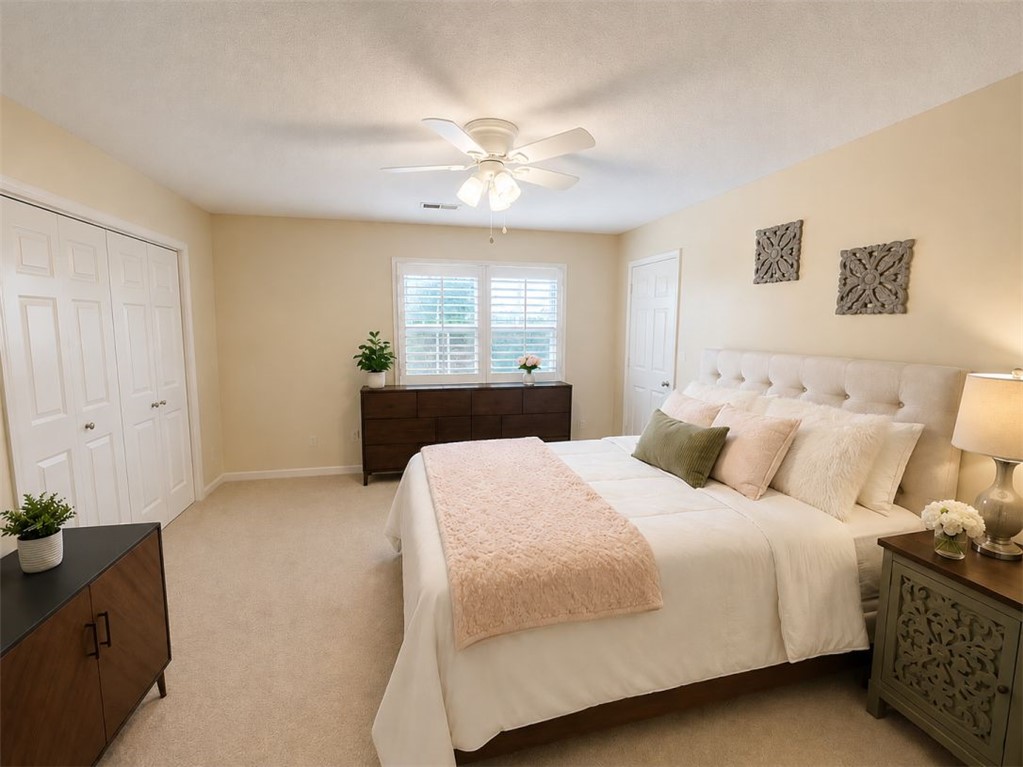 2018 Cardinal Park Drive Anderson, SC 29621 - Photo 8 of 11 A well-lit bedroom offering plush carpeting and a convenient ceiling fan for ultimate comfort.