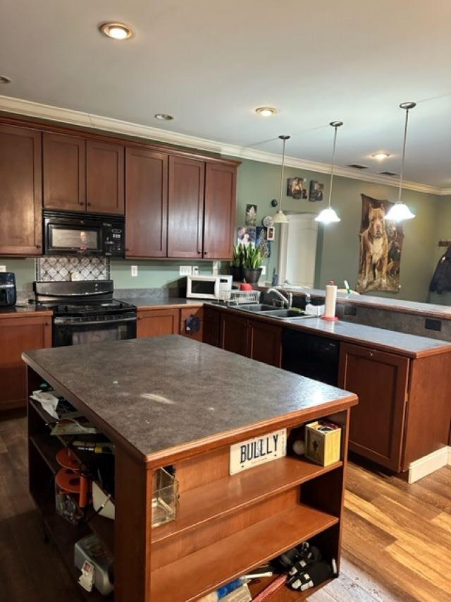 1338 Irene Road Cherry Valley, IL 61016 - Photo 5 of 15 a kitchen with kitchen island granite countertop a sink cabinets and stainless steel appliances