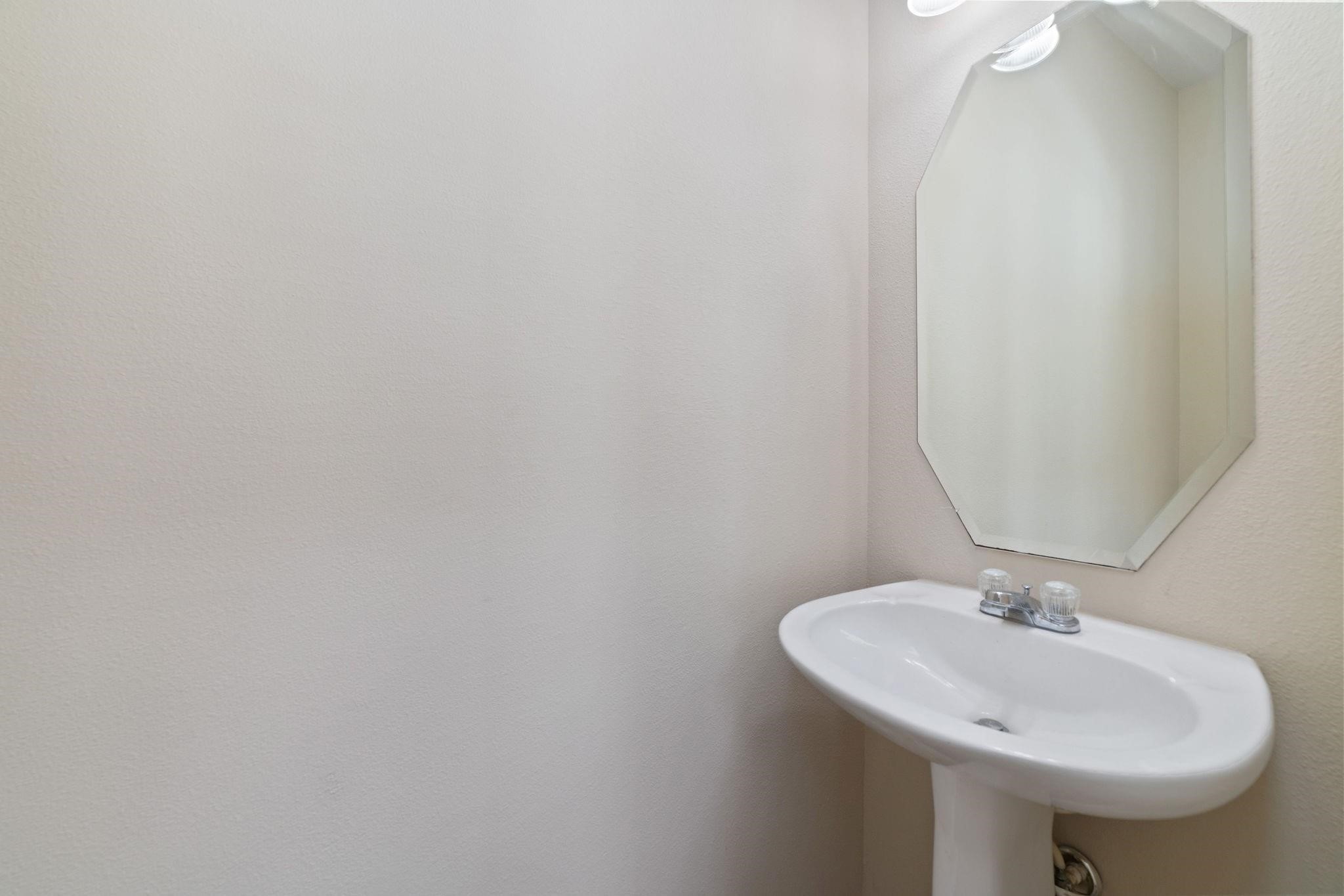 14923 Tuttle Point Drive Houston, TX 77082 - Photo 15 of 24 a bathroom with a sink and a mirror