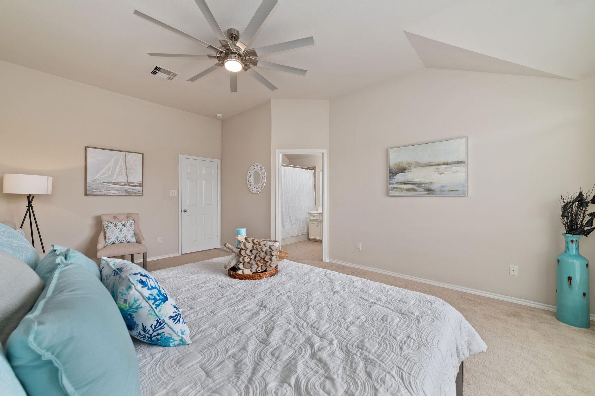 14923 Tuttle Point Drive Houston, TX 77082 - Photo 18 of 24 a bedroom with bed and a chandelier