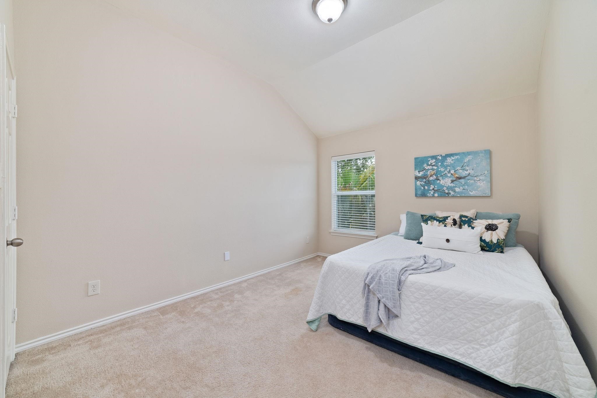 14923 Tuttle Point Drive Houston, TX 77082 - Photo 20 of 24 a bedroom with a bed and a window