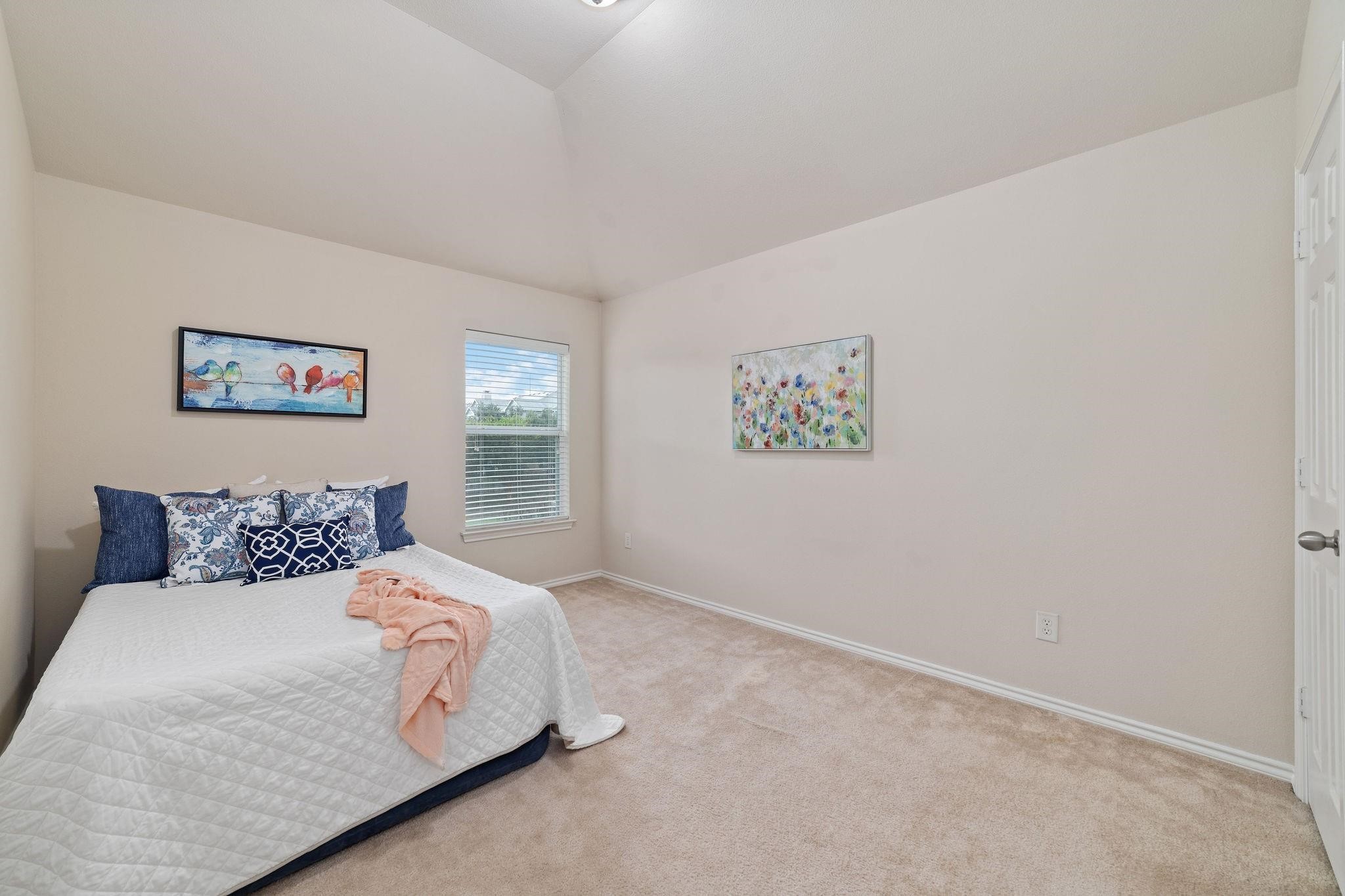 14923 Tuttle Point Drive Houston, TX 77082 - Photo 21 of 24 a bedroom with a bed and wall painting