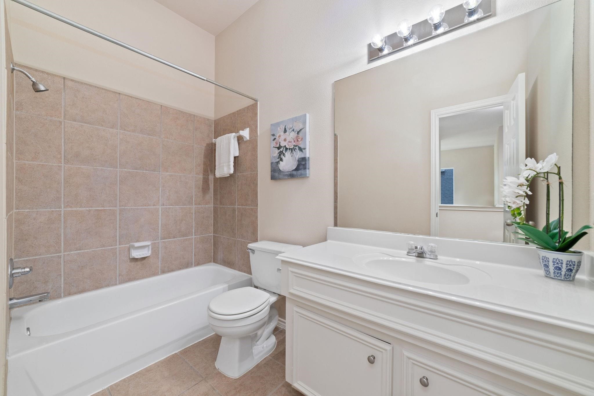 14923 Tuttle Point Drive Houston, TX 77082 - Photo 22 of 24 a bathroom with a sink a toilet and shower