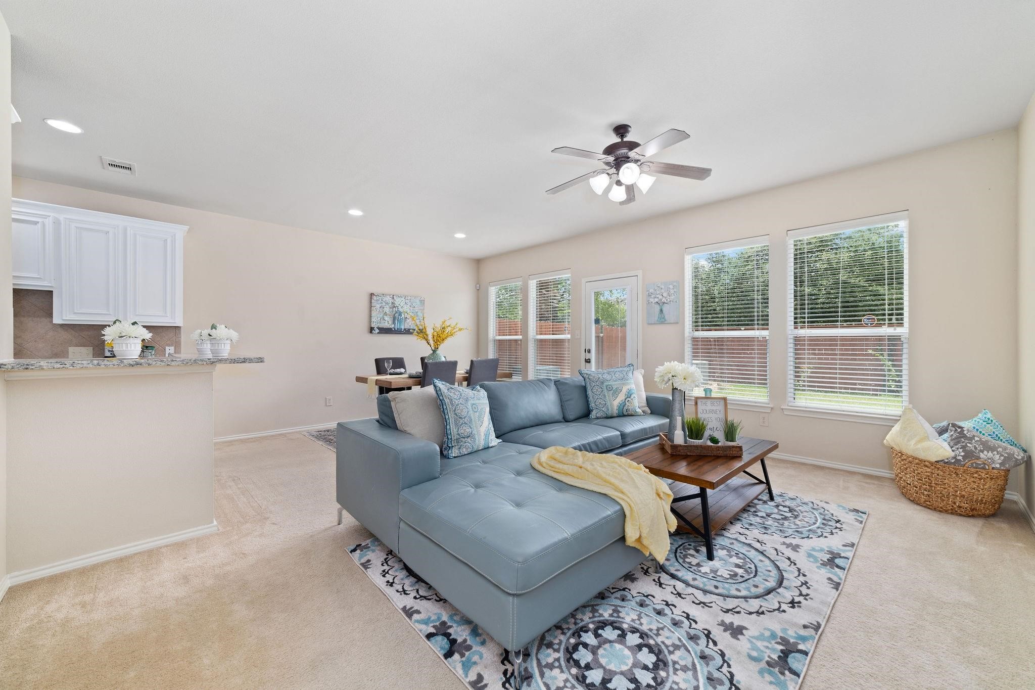 14923 Tuttle Point Drive Houston, TX 77082 - Photo 5 of 24 a living room with furniture a fireplace and a chandelier