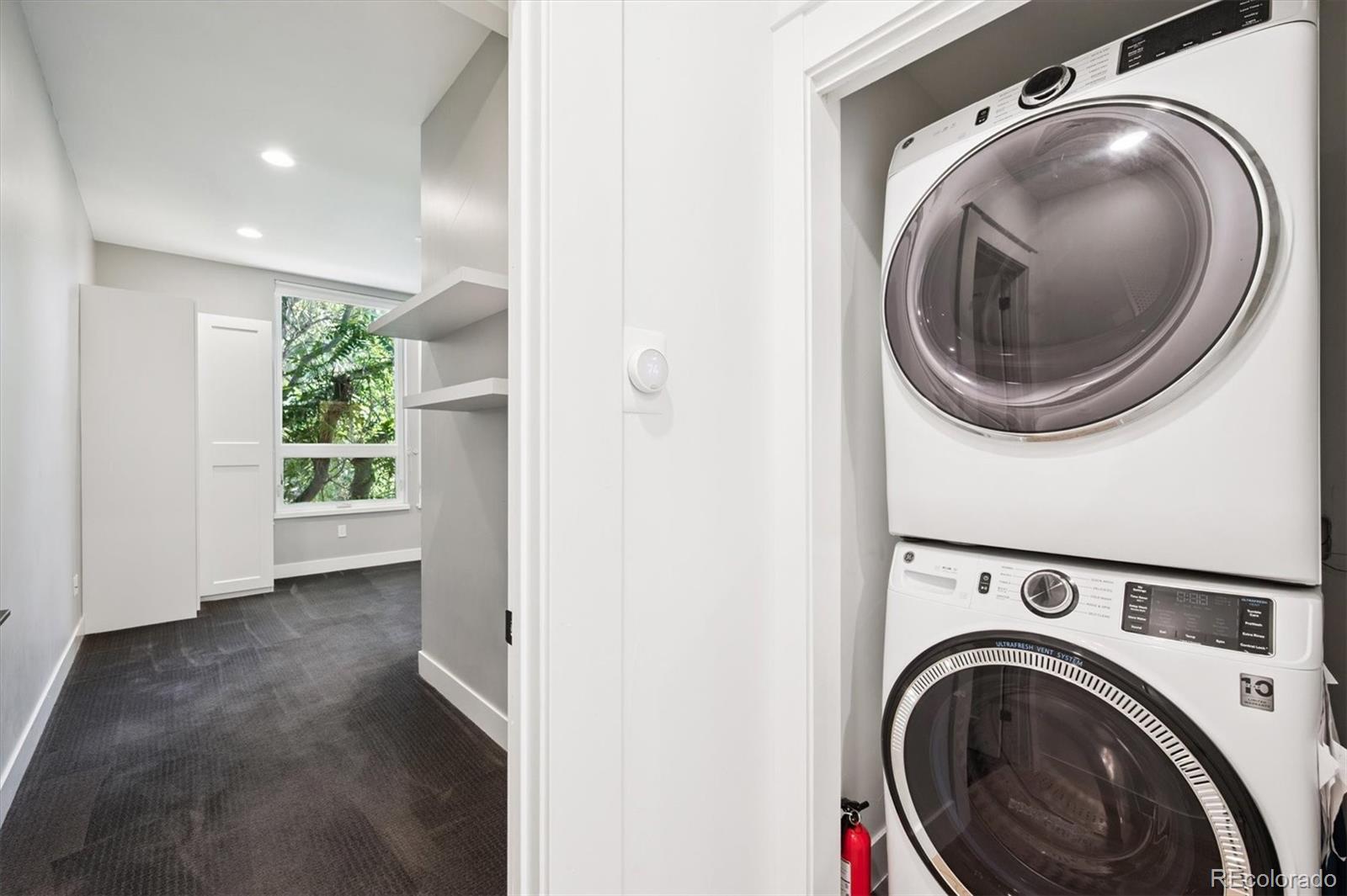 3124 Gilpin Street Denver, CO 80205 - Photo 11 of 46 a view of a hallway with washer and dryer