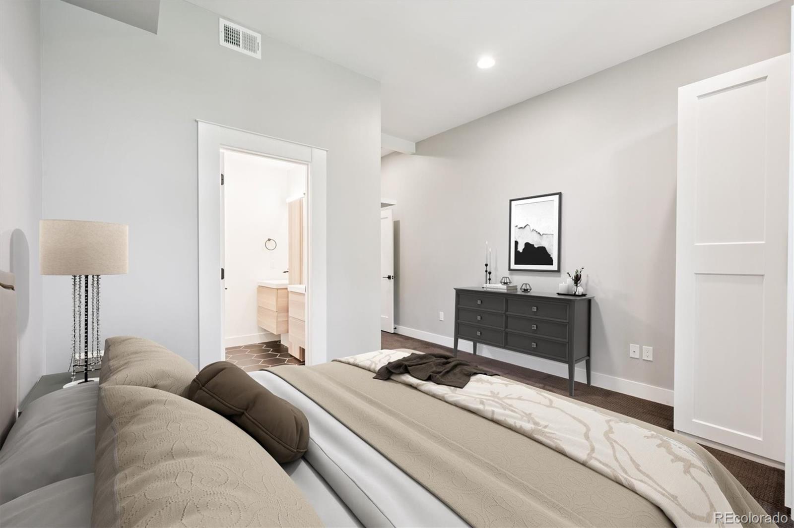 3124 Gilpin Street Denver, CO 80205 - Photo 13 of 46 a bedroom with a bed and a table