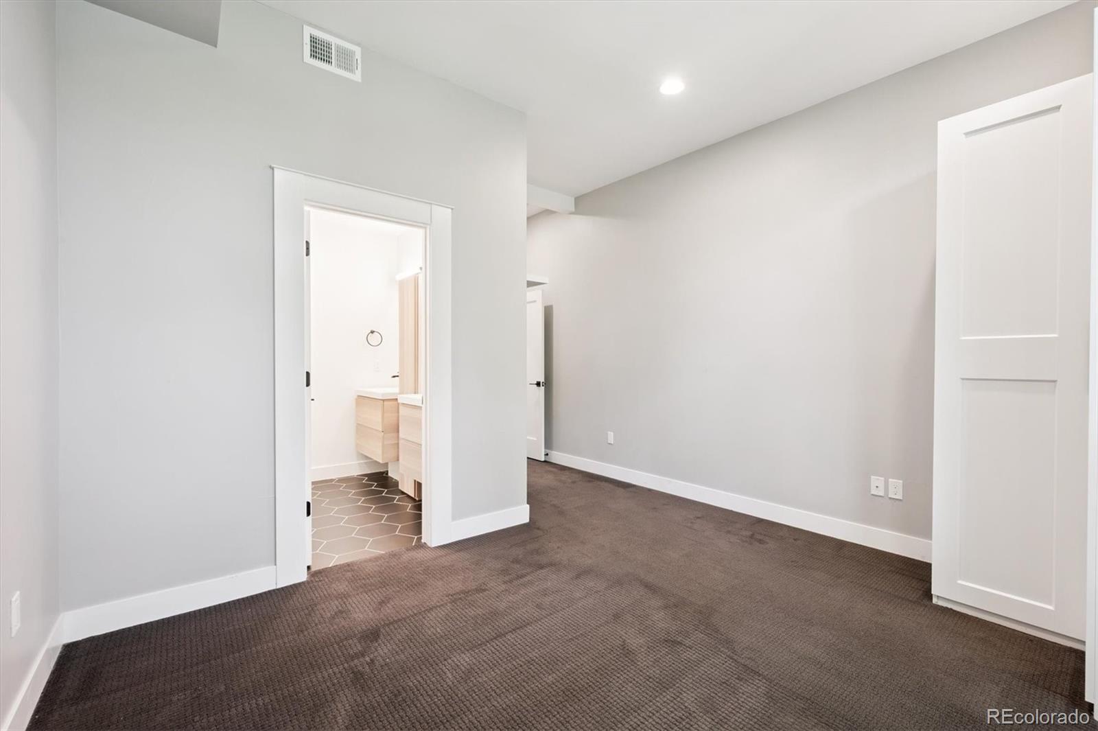 3124 Gilpin Street Denver, CO 80205 - Photo 14 of 46 an empty room with a bathroom