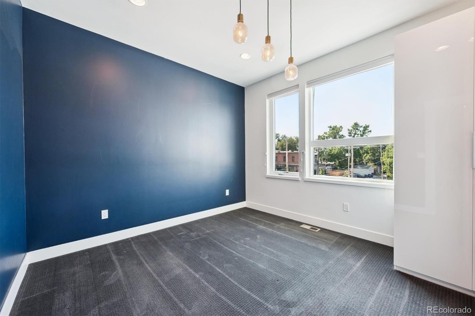 3124 Gilpin Street Denver, CO 80205 - Photo 20 of 46 a view of an empty room with a window