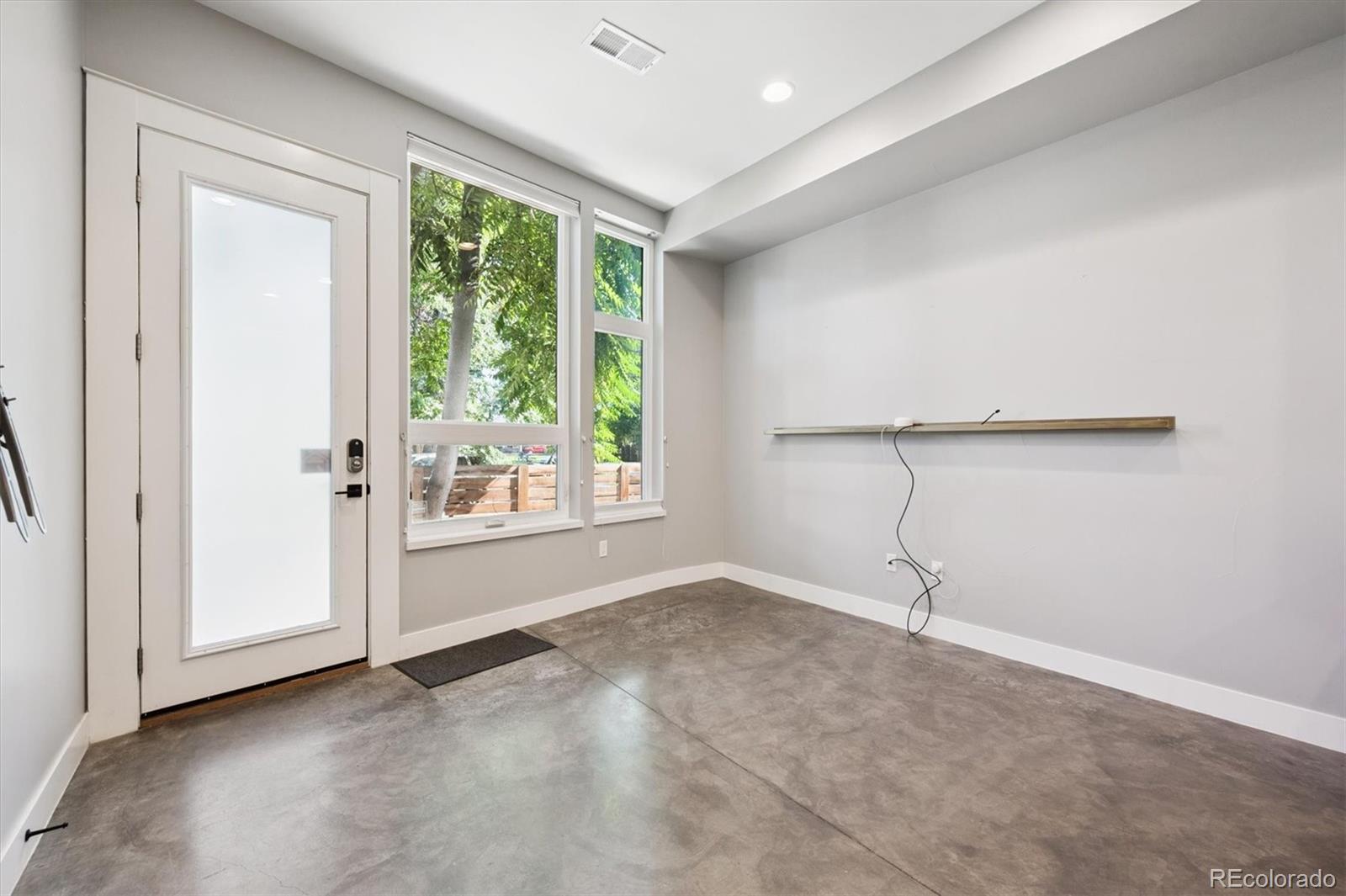 3124 Gilpin Street Denver, CO 80205 - Photo 4 of 46 a view of an empty room with a window