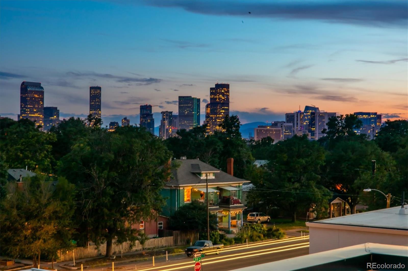 3124 Gilpin Street Denver, CO 80205 - Photo 41 of 46 a front view of a building with streets and trees