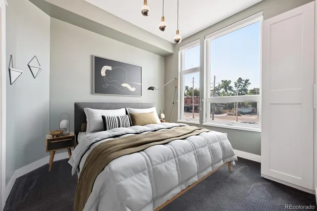 a bedroom with bed and a window