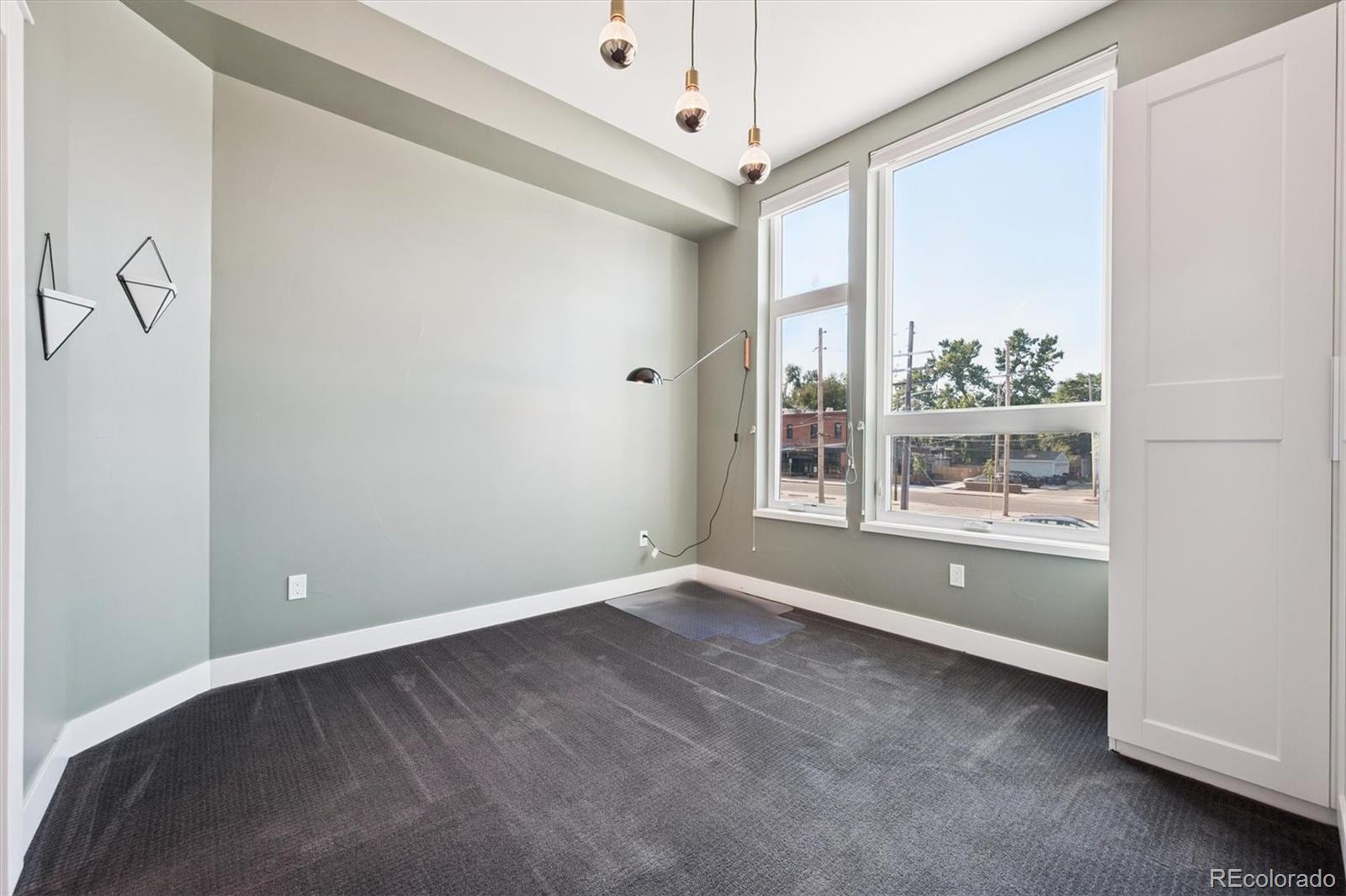 3124 Gilpin Street Denver, CO 80205 - Photo 8 of 46 a view of an empty room with a window