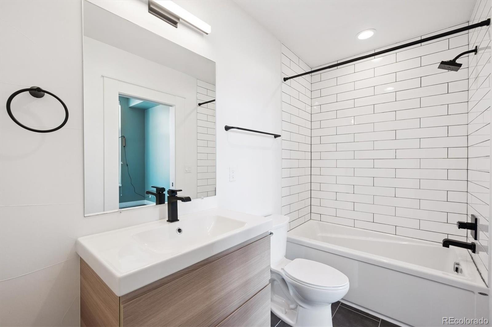 3124 Gilpin Street Denver, CO 80205 - Photo 10 of 46 a bathroom with a sink a toilet and shower