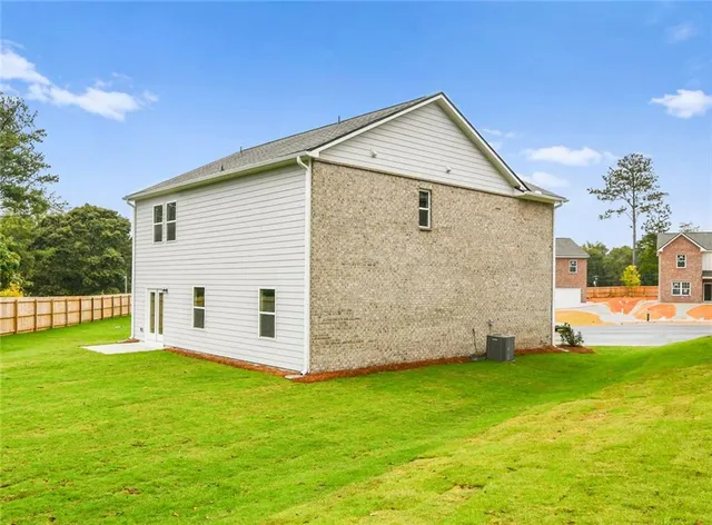 a view of a backyard with a garden and plants