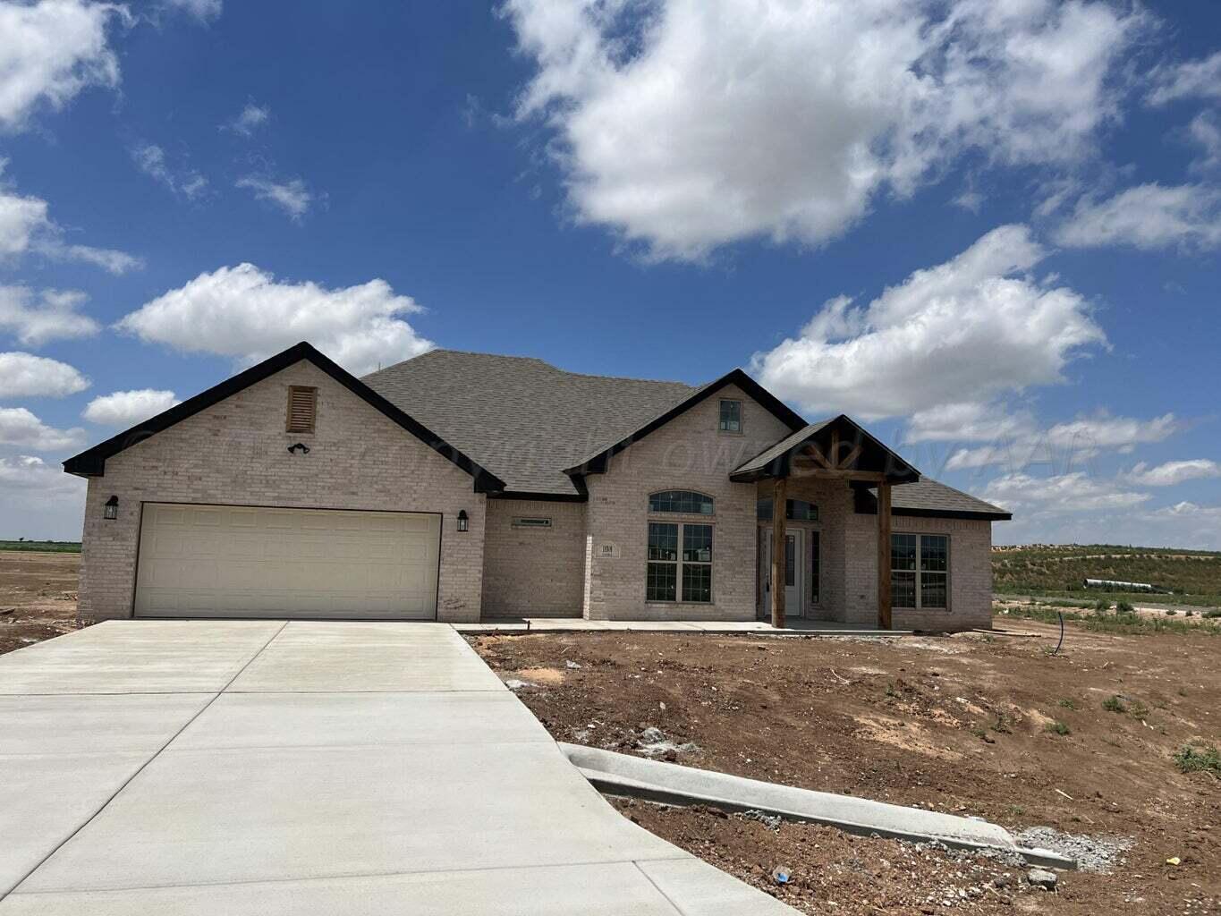 18300 Taurus Trail Canyon, TX 79015 - Photo 1 of 2 a front view of a house with a yard