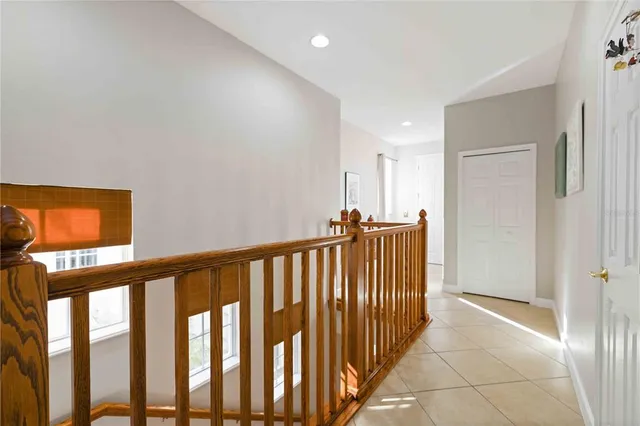 a view of kitchen with refrigerator and furniture