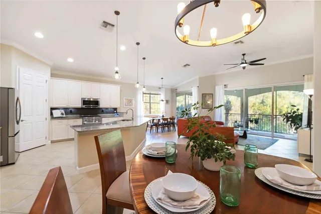 a bedroom with a large bed and a large window with wooden floor