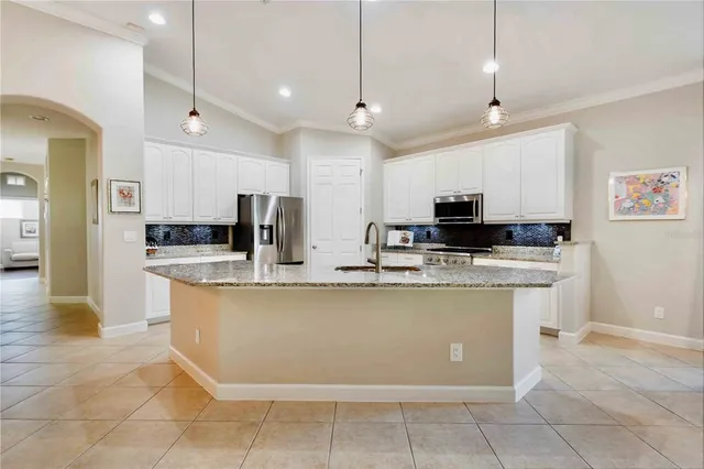 a view of walk in closet with clothes