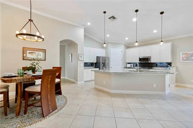 a balcony with furniture and a potted plant
