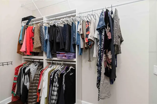 a view of a house with swimming pool and sitting space