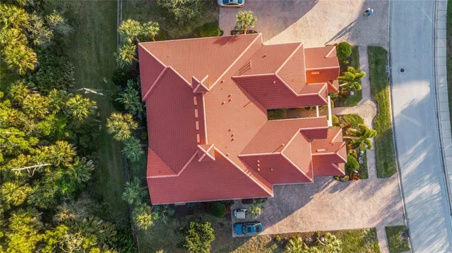 an aerial view of a houses with a city view
