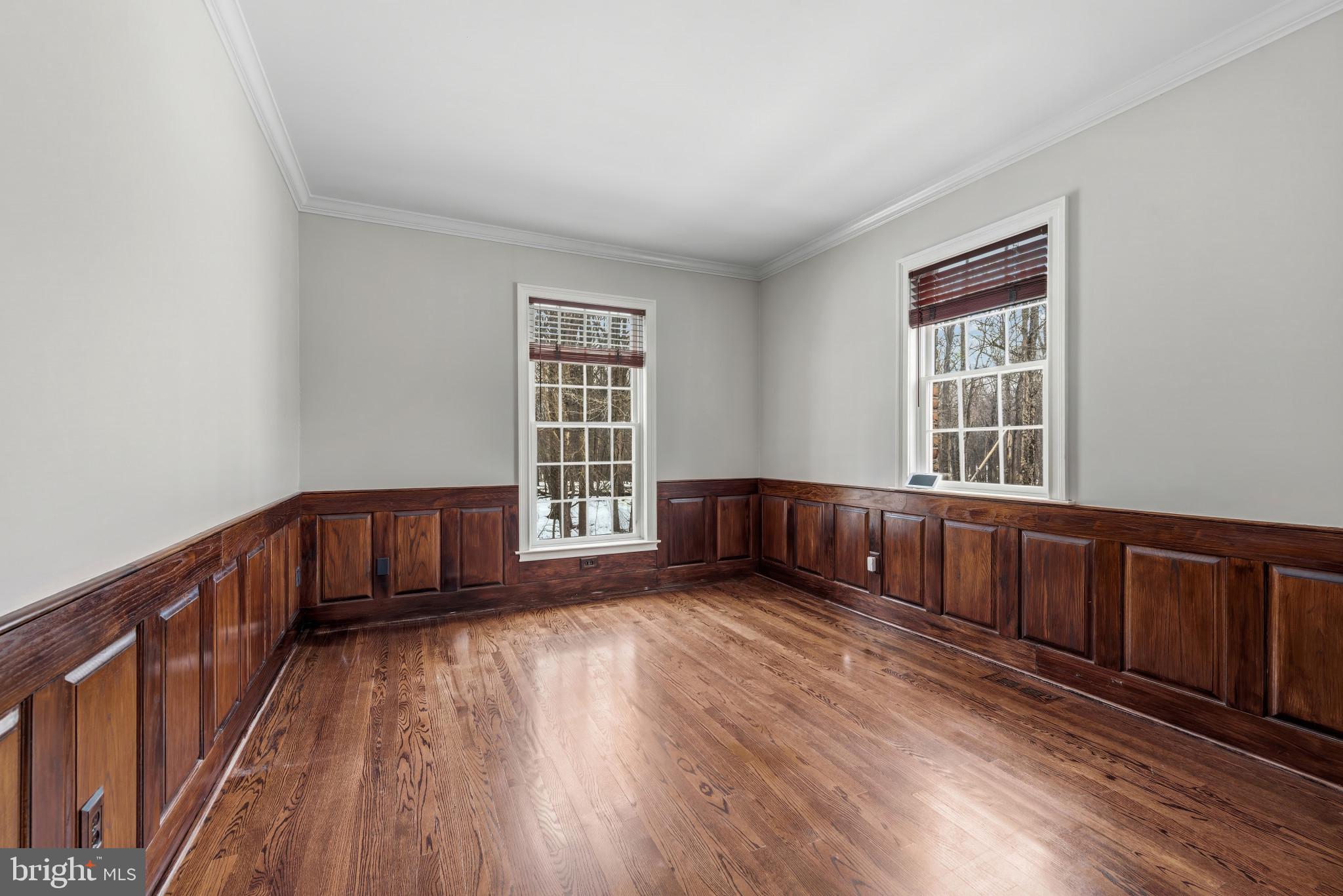14002 Fox Run Court Phoenix, MD 21131 - Photo 18 of 64 a view of an empty room with wooden floor and windows