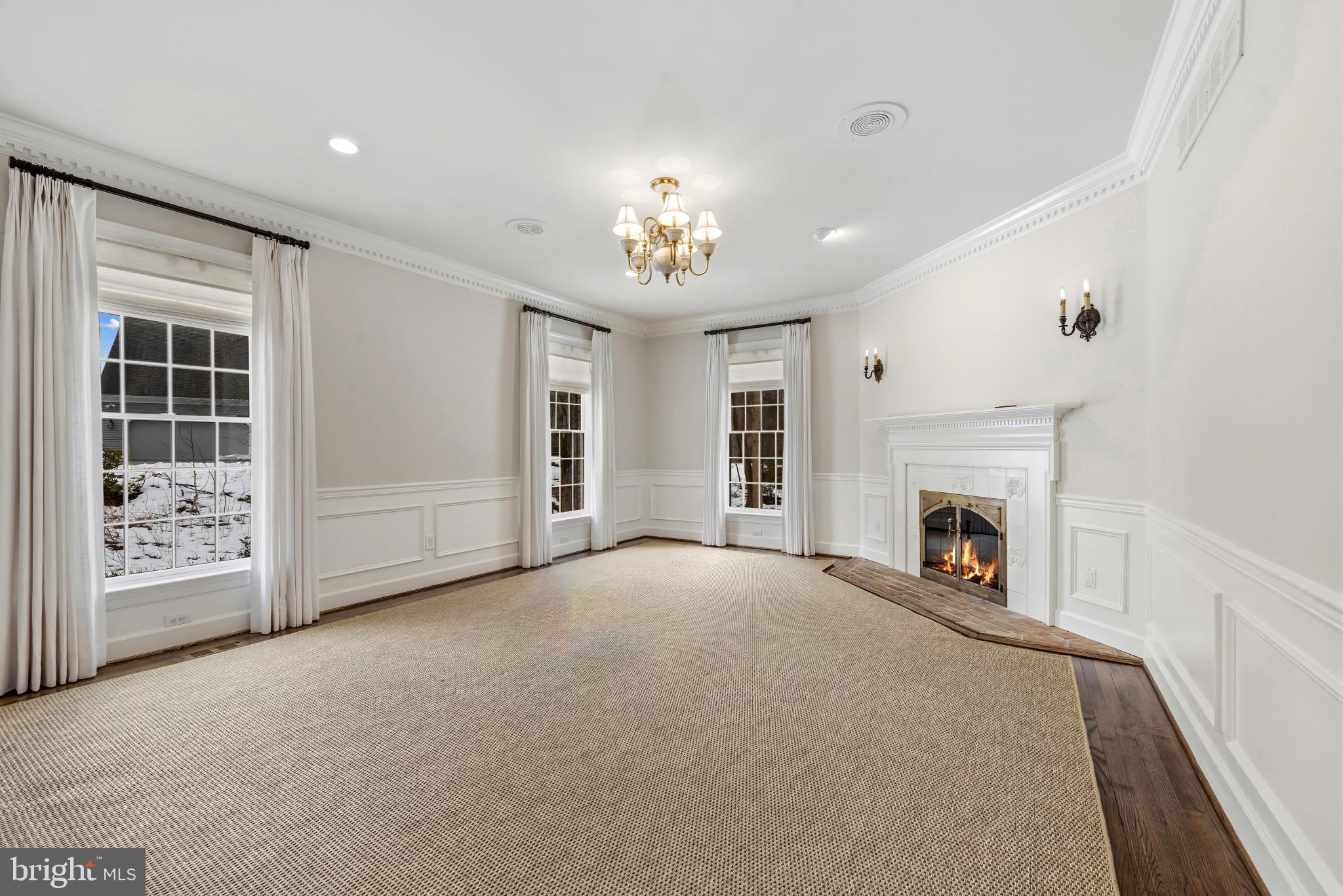 14002 Fox Run Court Phoenix, MD 21131 - Photo 24 of 64 an empty room with windows and fireplace