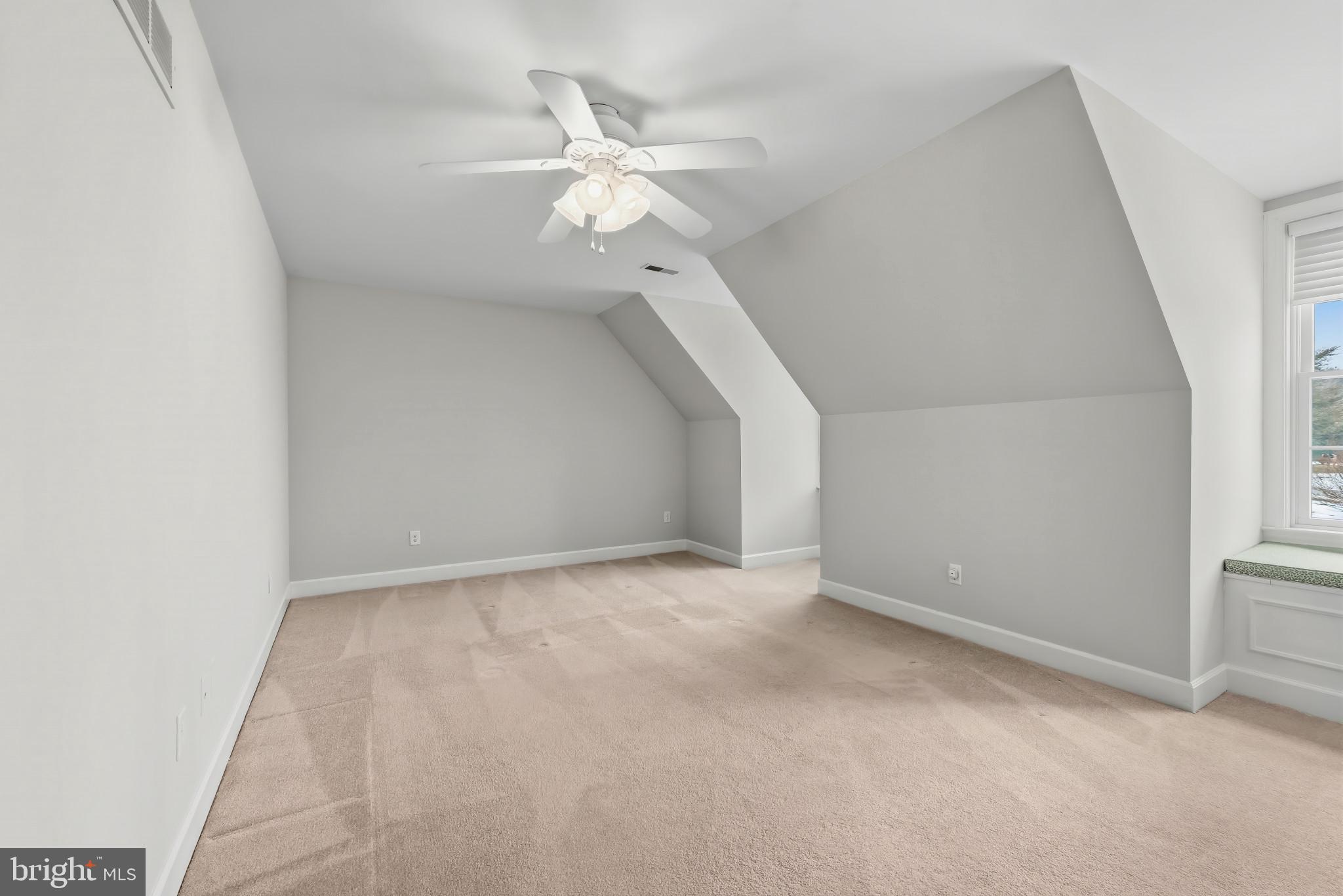 14002 Fox Run Court Phoenix, MD 21131 - Photo 31 of 64 an empty room with a chandelier fan and windows