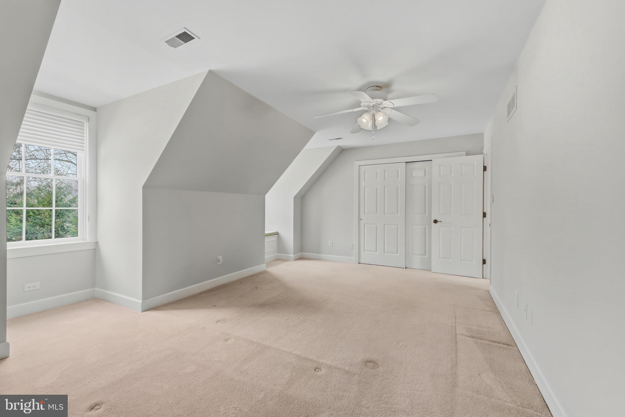 14002 Fox Run Court Phoenix, MD 21131 - Photo 32 of 64 an empty room with chandelier fan and windows