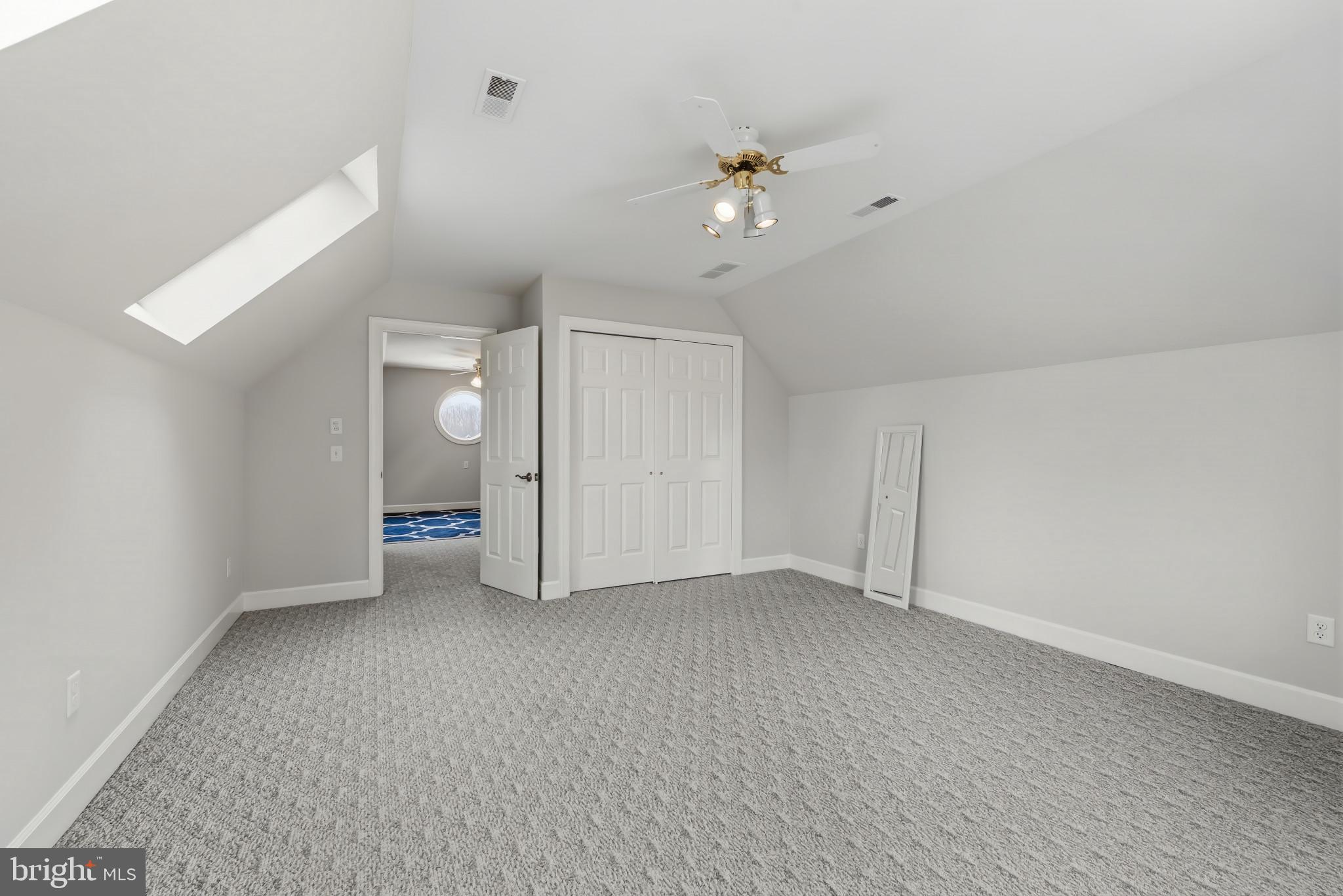 14002 Fox Run Court Phoenix, MD 21131 - Photo 37 of 64 a view of an empty room with a chandelier fan
