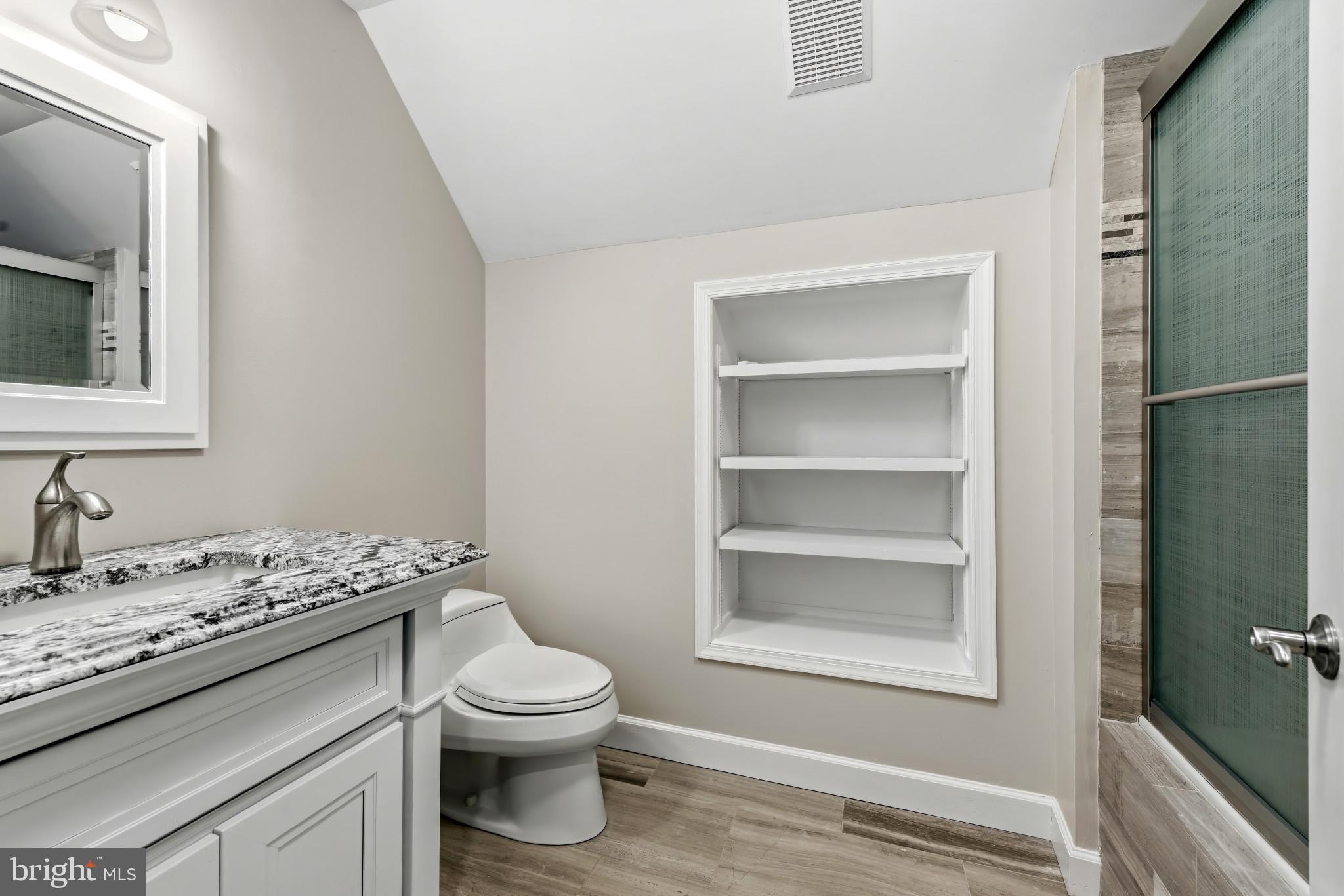 14002 Fox Run Court Phoenix, MD 21131 - Photo 41 of 64 a bathroom with a granite countertop sink toilet and mirror