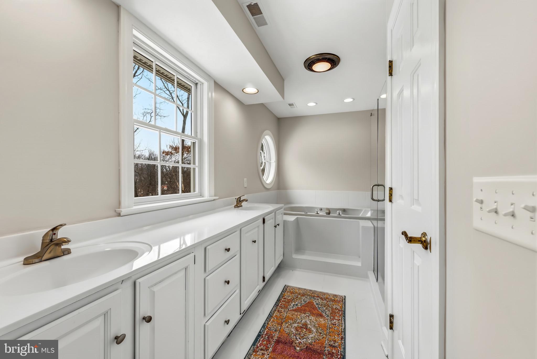 14002 Fox Run Court Phoenix, MD 21131 - Photo 42 of 64 a bathroom with a granite countertop sink mirror bathtub and shower