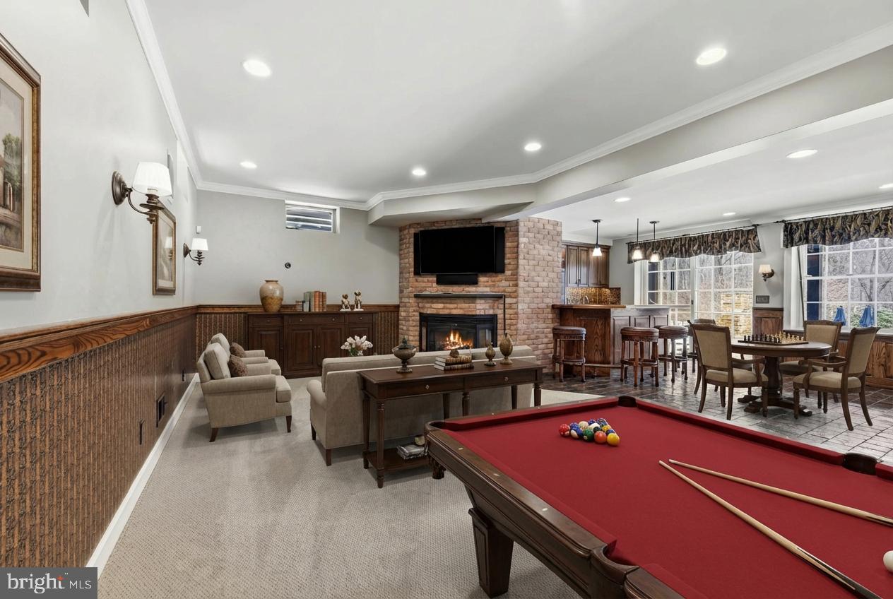14002 Fox Run Court Phoenix, MD 21131 - Photo 45 of 64 a living room with furniture a flat screen tv and kitchen view