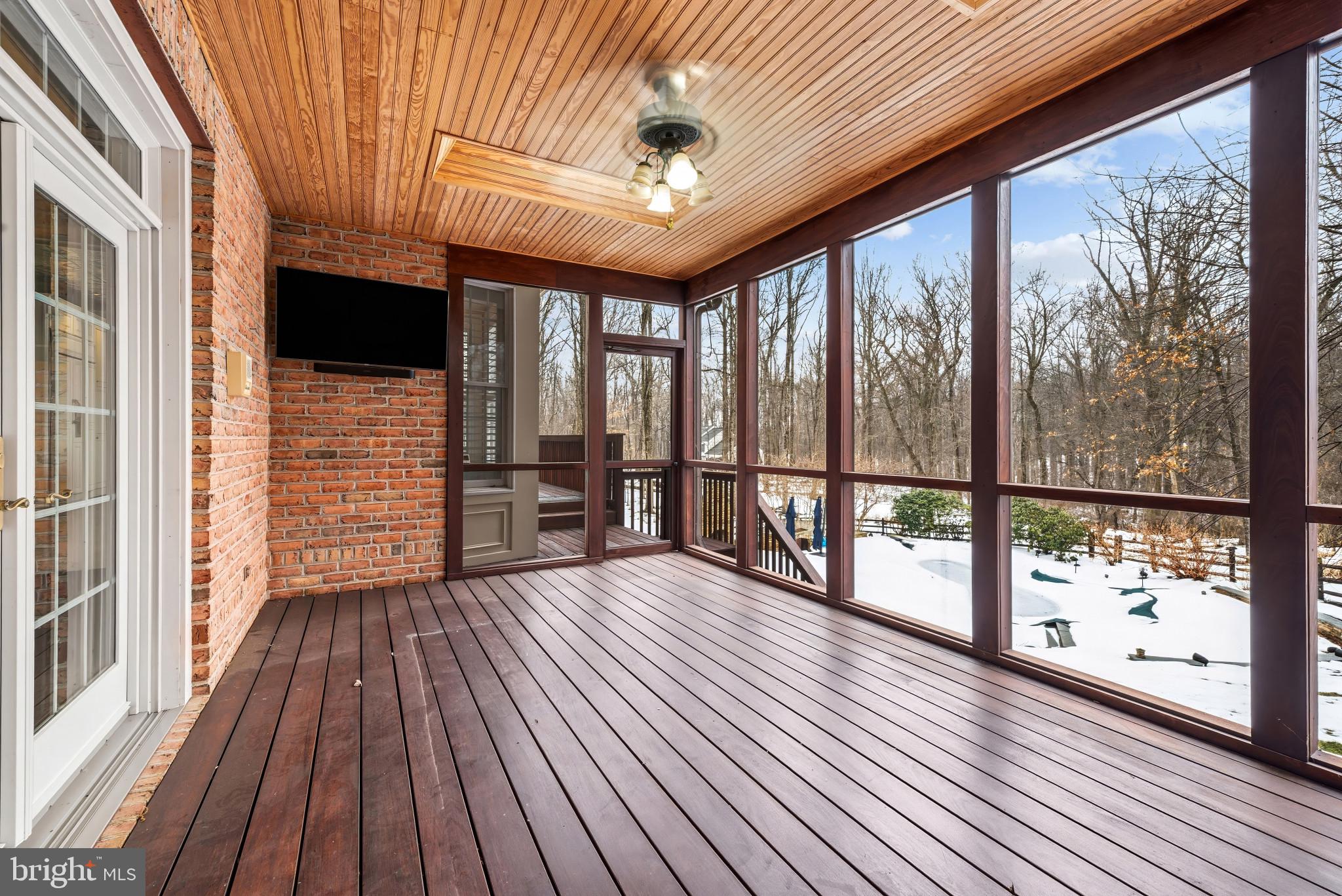 14002 Fox Run Court Phoenix, MD 21131 - Photo 50 of 64 a view of a porch with wooden floor and iron stairs