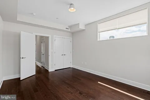a view of room with wooden floor