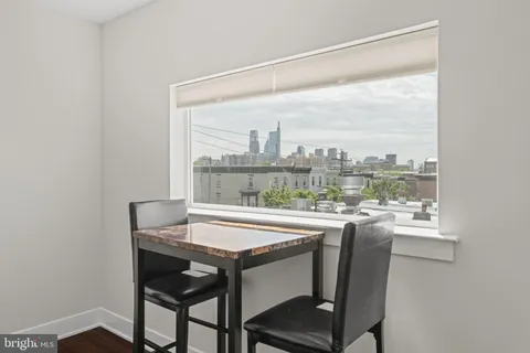 a dining room with a table and chairs