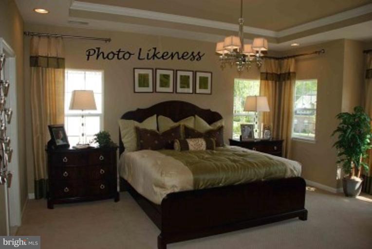 4235 Forge Road Perry Hall, MD 21128 - Photo 8 of 8 a bedroom with a bed a large window and a chandelier