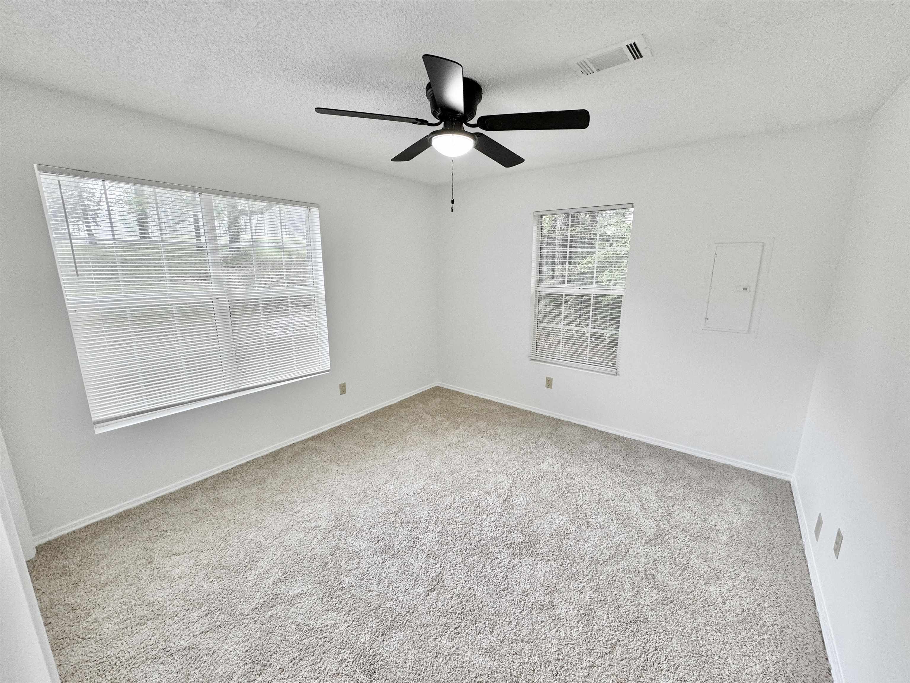 520 Stone Road Pinson, TN 38366 - Photo 12 of 30 Spare room featuring a textured ceiling, visible vents, ceiling fan, baseboards, and carpet floors