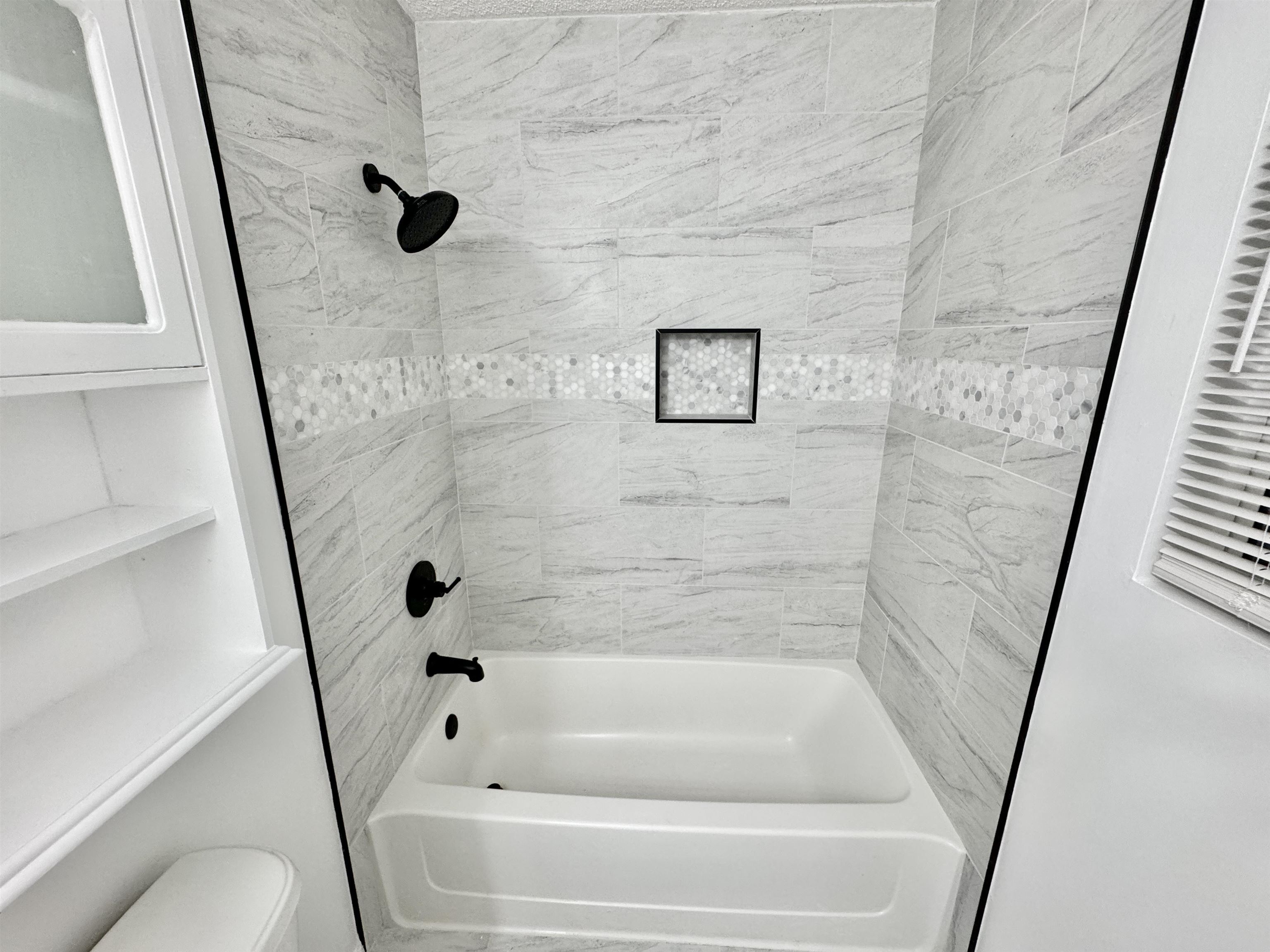 520 Stone Road Pinson, TN 38366 - Photo 19 of 30 Bathroom featuring toilet and shower / bathing tub combination