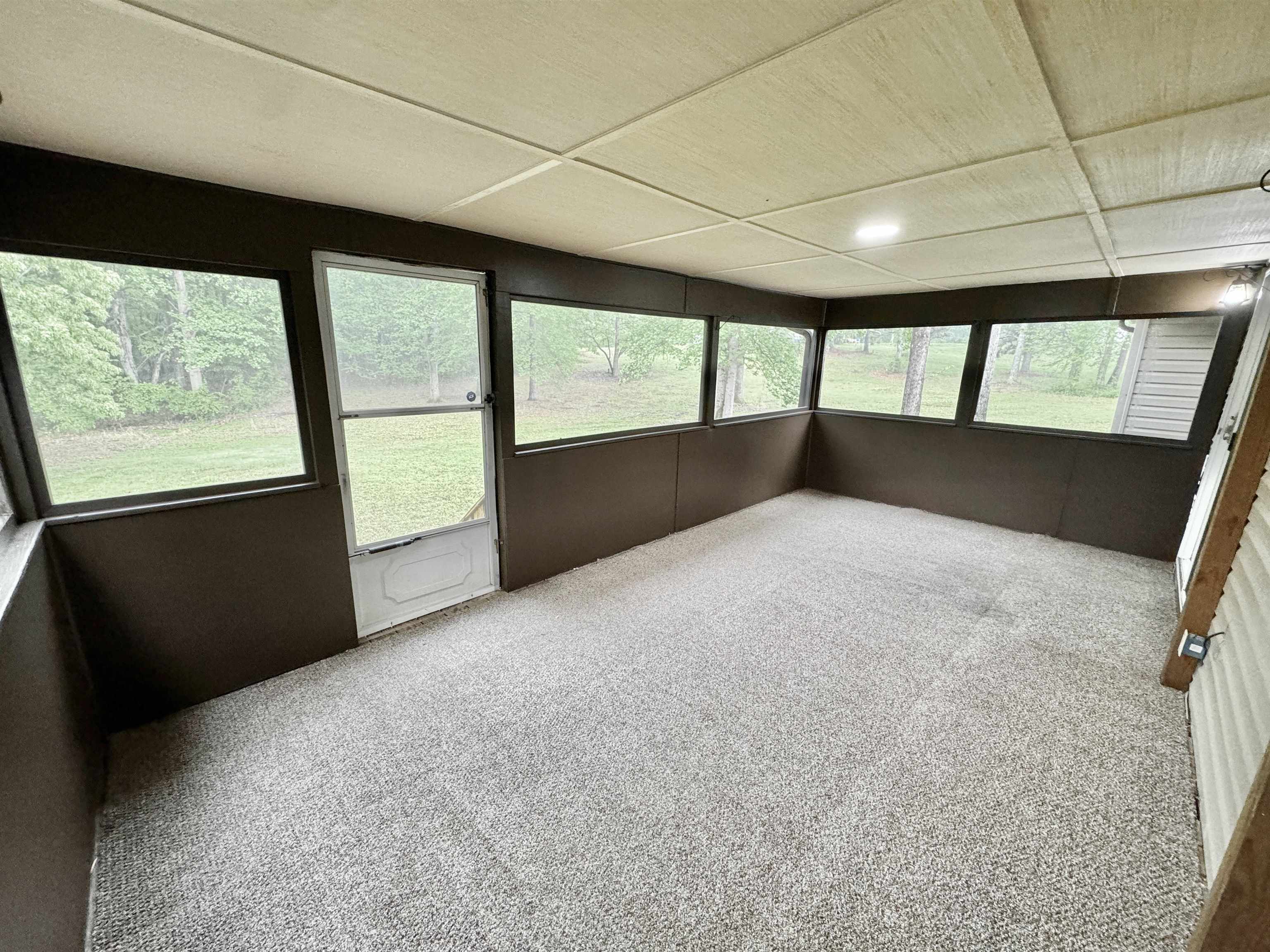 520 Stone Road Pinson, TN 38366 - Photo 24 of 30 Unfurnished sunroom with carpet floors