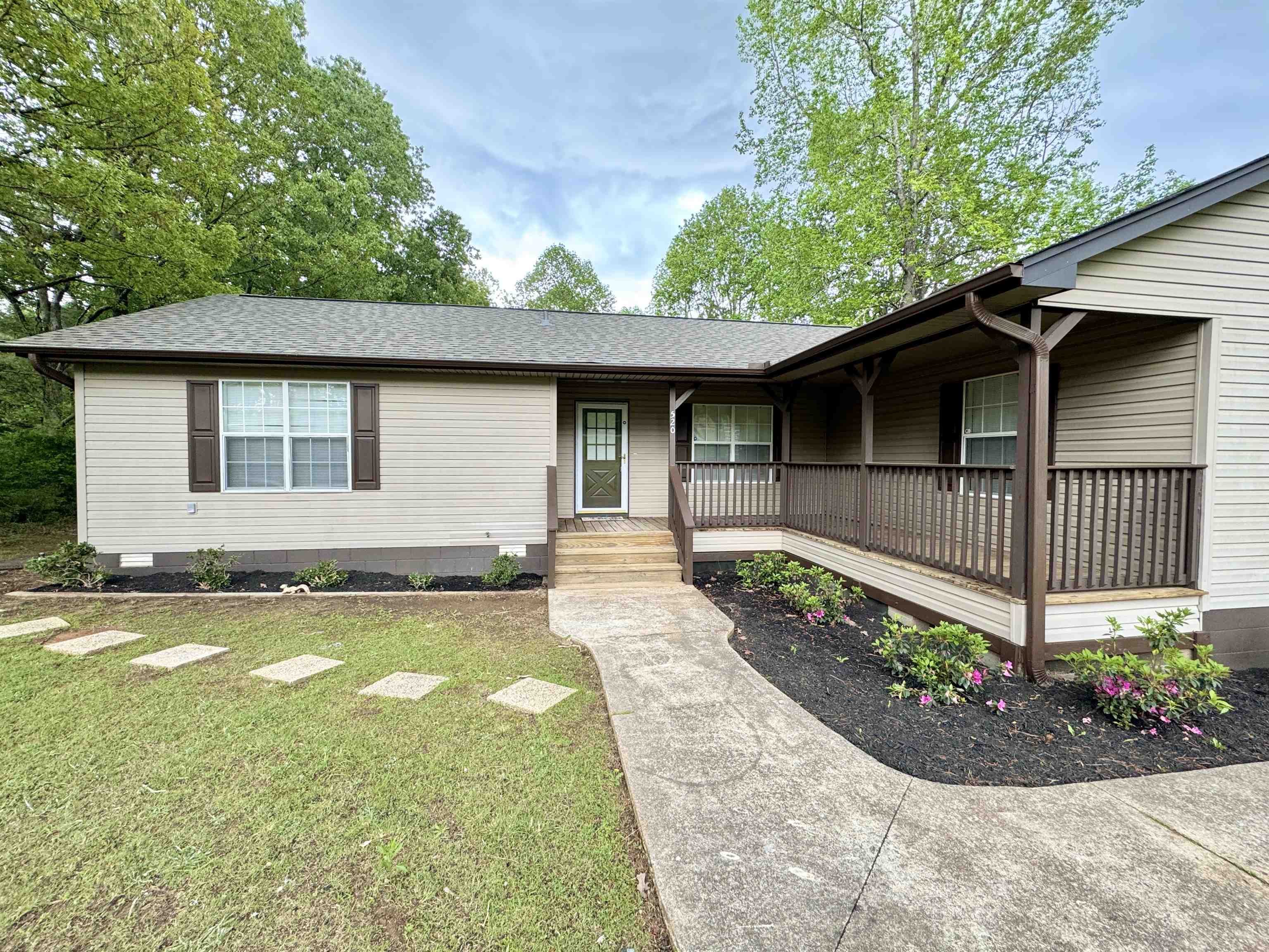 520 Stone Road Pinson, TN 38366 - Photo 3 of 30 Ranch-style house featuring covered porch, a shingled roof, and a front yard