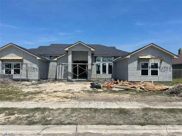 a front view of a house with a ocean view