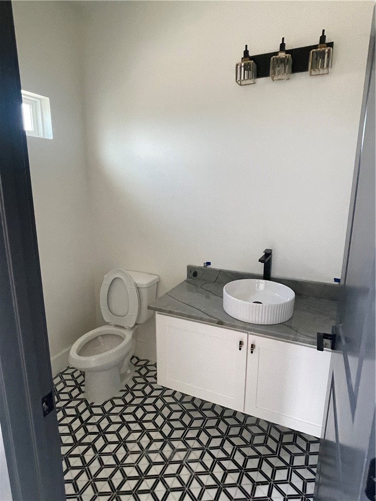 2558 Pacific View Street Corpus Christi, TX 78415 - Photo 11 of 12 a bathroom with a sink and a mirror