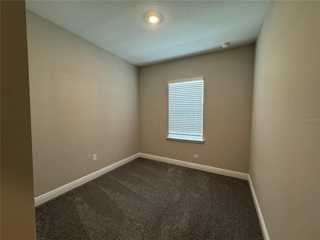 16434 Hamlin Hills Road Winter Garden, FL 34787 - Photo 34 of 50 an empty room with a window