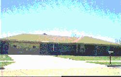 a view of a yard with an ocean view