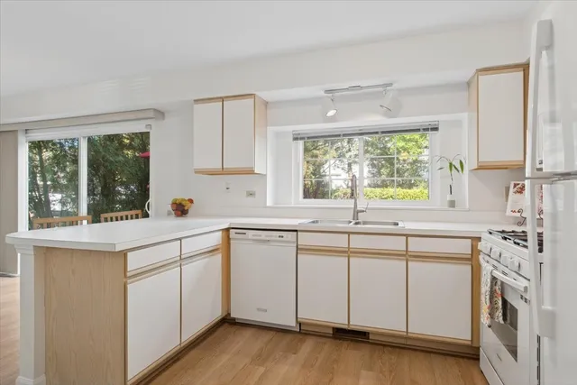 a kitchen with a sink stove and cabinets