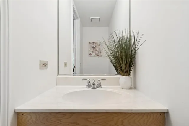 a bathroom with a bathtub and a sink